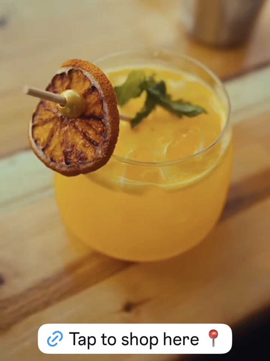 Citrus mocktail garnished with fresh fruit